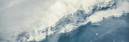 Snow covered mountain and ice shelf