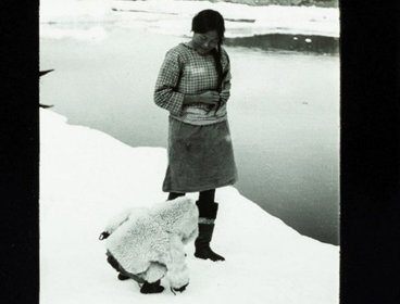 Old black and white photograph of an Inuit woman and child, British East Greenland expedition 1935-36.