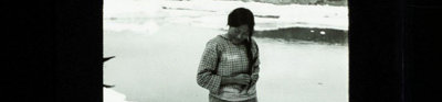 Old black and white photograph of an Inuit woman and child, British East Greenland expedition 1935-36.