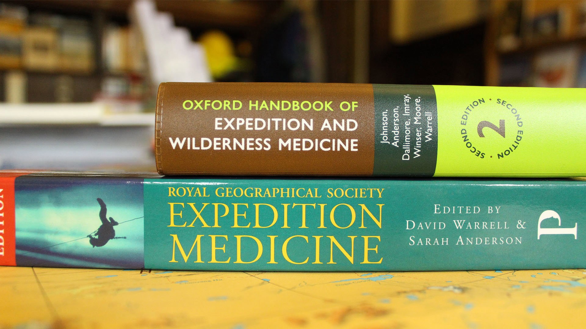 One book lays on top of another, and both are about expidition medicine.