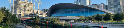 River flowing in urban area amongst modern buildings. 