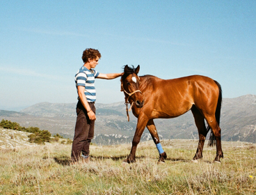 Louis with a horse in the Ligurian Alps.