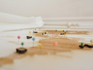 Map with colourful pins stuck to them 