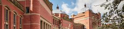 University of Birmingham campus with blossom in the foreground