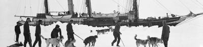 Dogs and men on ice, with Endurance behind, taken during Imperial Trans-Antarctic Expedition 1914-1916