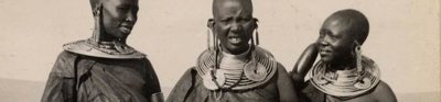 Three Kenyans dressed in tribal clothing