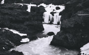 Black and white photo of a frozen waterfall.