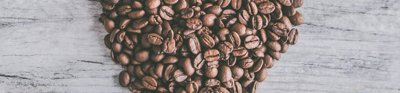 Coffee beans arranged in a heart shape
