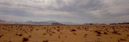 Brown sand under white clouds