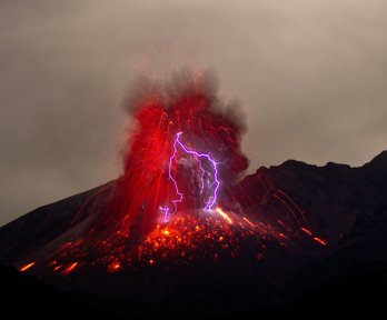 A volcano erupting, causing lightning to occur