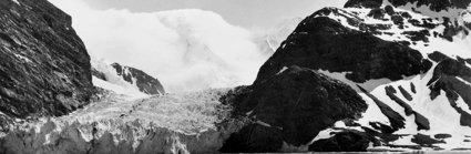 Black and white landscape showing ice, snow and mountains