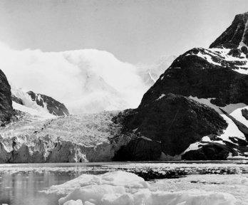 Black and white landscape showing ice, snow and mountains