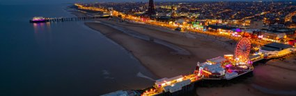 An aerial view over Blackpool beach at dusk