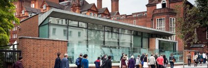 Exterior of the Royal Geographical Society Pavilion and main entrance, with people walking up to the entrance