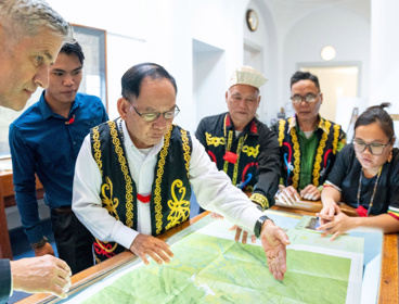 Society’s Director with representatives of the Penan communities, looking at Penan Community Maps
