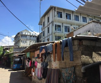 A street scene with drying clothes in Colombo