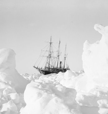 Old black and white photograph of the Endurance ship stuck in ice.