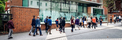 People walking along Exhibition Road outside of the Society's entrance.