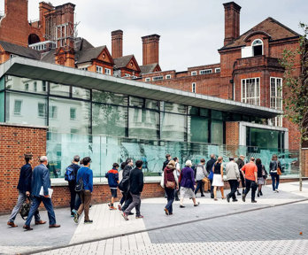 People walking along Exhibition Road outside of the Society's entrance.