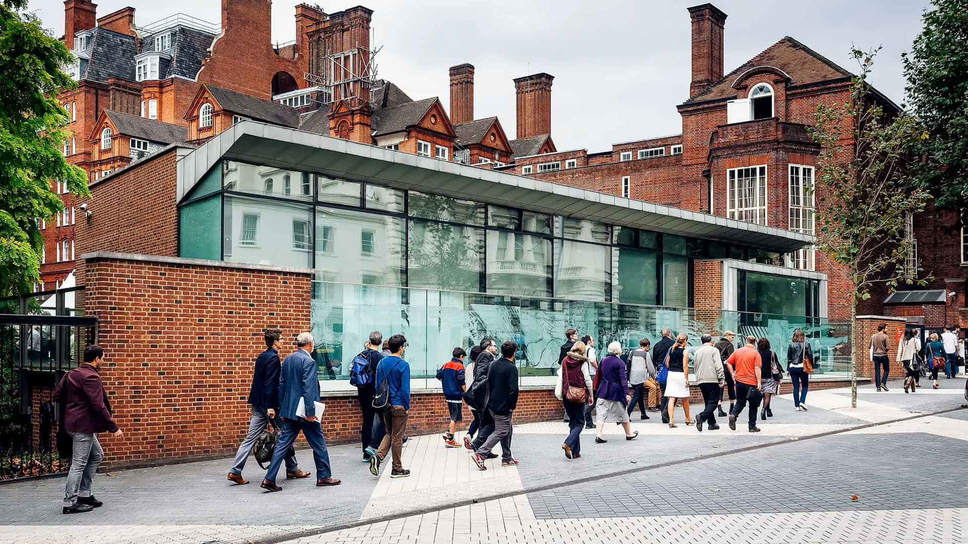 People walking along Exhibition Road outside of the Society's entrance.