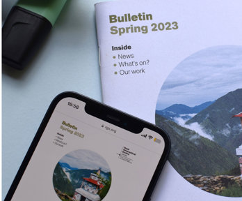 The Society's spring 2023 Bulletin in print and displayed on a phone screen.