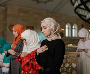 Women praying in a mosque.