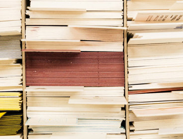 Stack of archive folders separated by labels seen from the side.