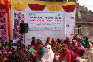 Figure 12 Oxfam India partner EFRAH and community from Madanpur Khadar, Delhi, India hold a Public Hearing. EFRAH supports the community to demand better education services and facilities from the government.