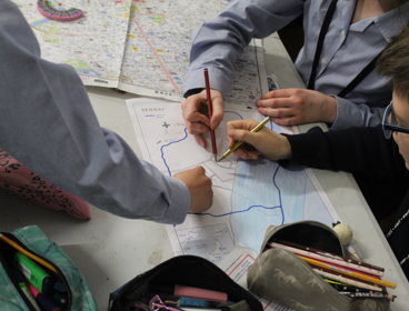 Children looking at a map during a mapping workshop