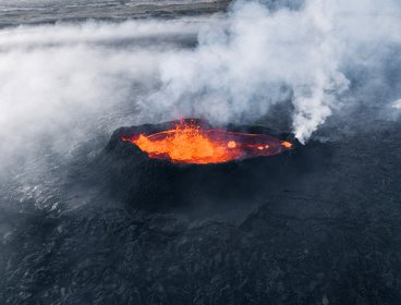 A volcanic crater with lava and gases