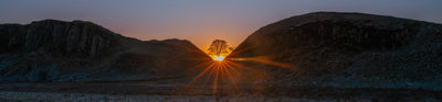 Sycamore Gap Tree with sun shining behind