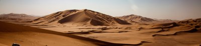 Sand dunes in a desert during daytime