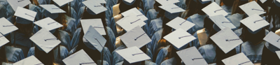 Rows of students at a graduation ceremony are captured from above