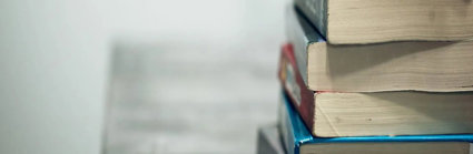 Close up of a stack of used textbooks.