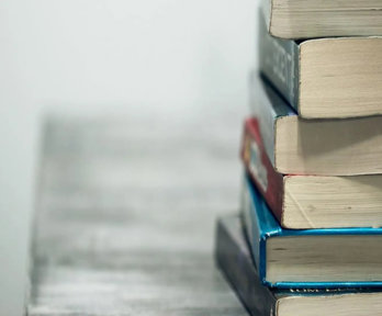 Close up of a stack of used textbooks.