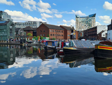 The Canal House and a canal with boats in central Birmingham near Brindley Place. 