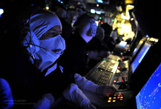 Operations room staff patrolling the water via radar on board the destroyer HMS Edinburgh. 