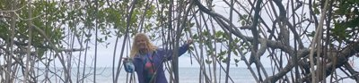 Katie Deakin standing in a mangrove