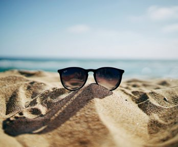 Sunglasses on a sandy