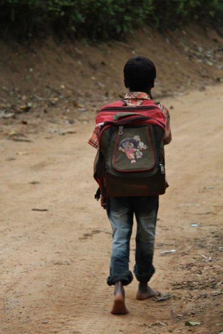 Figure 10 A student in Karnataka, India. Many children travel long distances on foot to reach school every day leaving them tired and less able to learn.