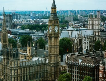 A view of the houses of Parliament in London with Big Ben and London stretching off into the distance