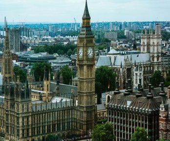 A view of the houses of Parliament in London with Big Ben and London stretching off into the distance