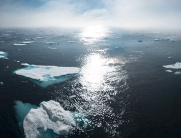Greenland ice sheets, the sun is gleaming down on them