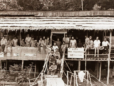 Group photo in black and white taken at base camp of the Gunung Mulu expedition, 1977 and 1978.