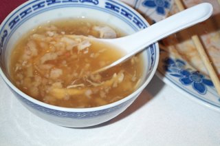 Birds nest soup in a blue and white china bowl with china spoon