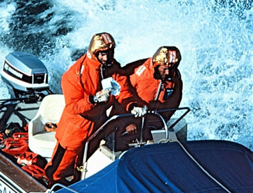 Fiennes and Burton navigate through rough sees in their Boston Whaler.