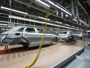 Cars being produced in a factory