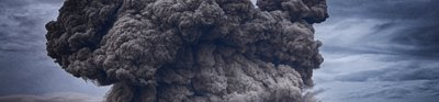 A volcano erupting with a huge ash cloud