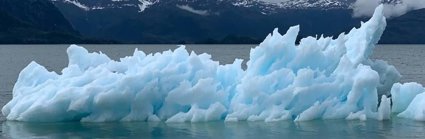 Antarctic scene with attractive blue glacier floating in the ocean