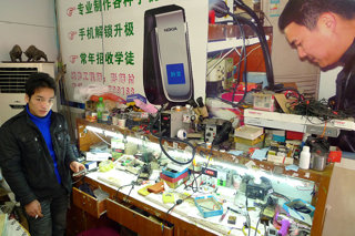 Mobile phone repair workshop in China. 